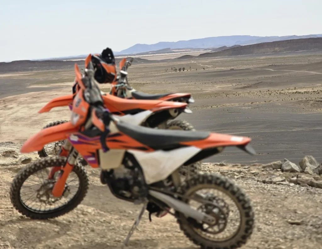 Gravel trail Morocco motorcycle tour, Morocco off-road motorcycle routes, Atlas Mountains gravel riding, Sahara desert motorbike tracks, KTM adventure Morocco.